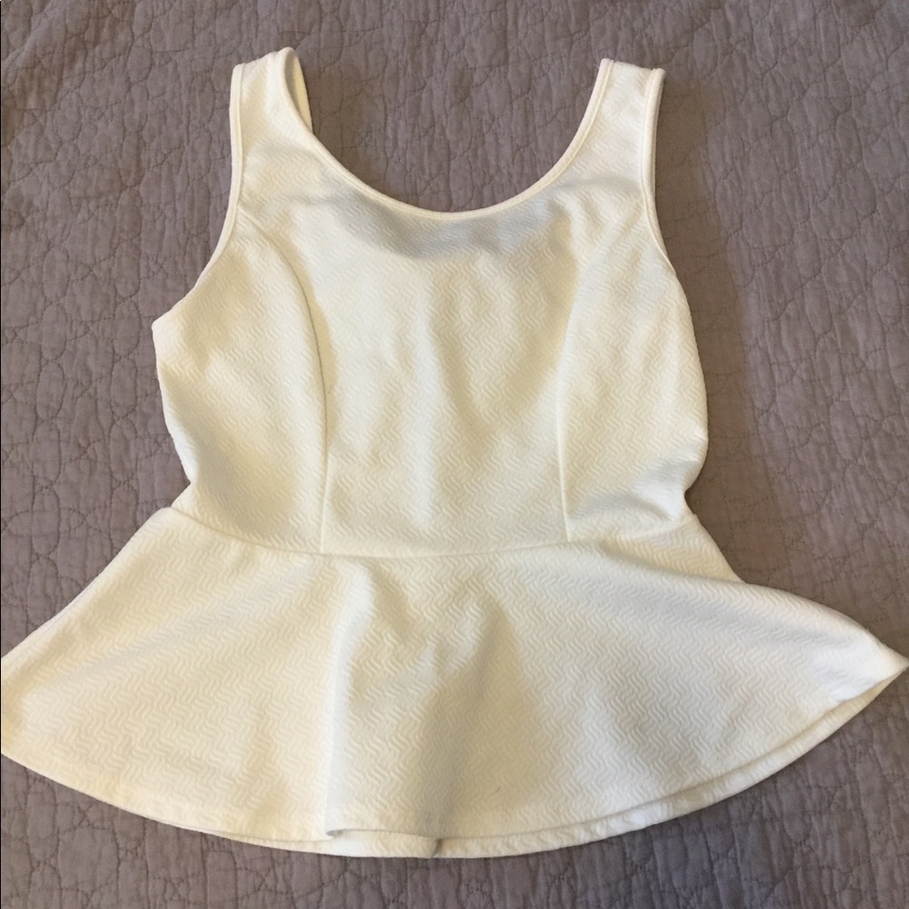 White blouse with black bow on back